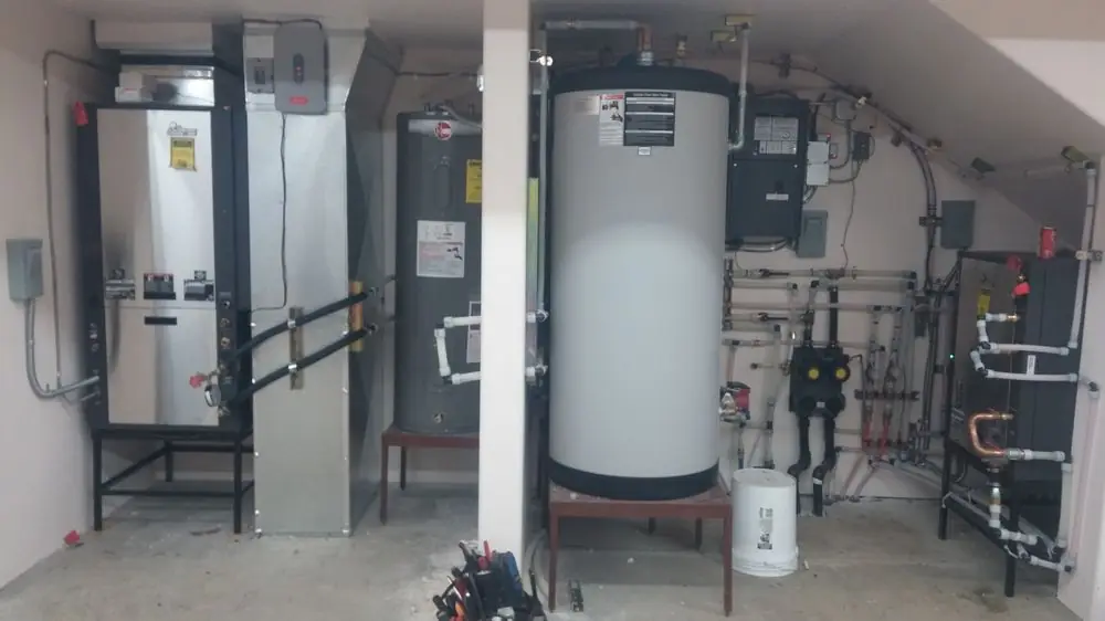 Mechanical room with two wall boilers and an indirect water tank