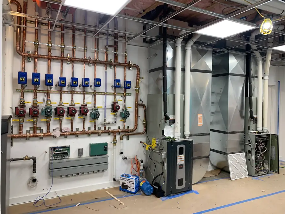 Galvanized supply plenums and ductwork in a finished mechanical room
